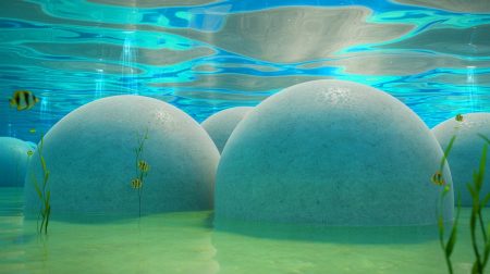 Illustration de sphères en béton immergées dans l'océan pour le stockage d'énergie renouvelable. Image réalisée par IA.